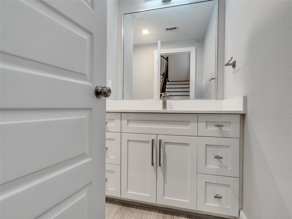 1122 West 16th Street, Unit C Houston, TX 77008 - Photo 24 of 38 a bathroom with a sink vanity and mirror