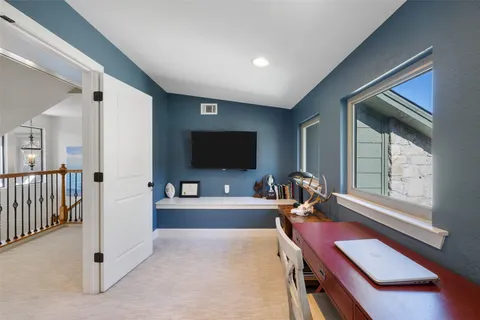 a bedroom with bed and a chandelier