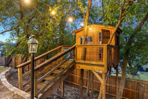 a view of a kitchen with a table and chairs