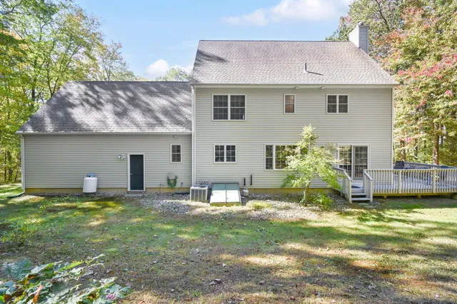 a house view with a sitting space and garden
