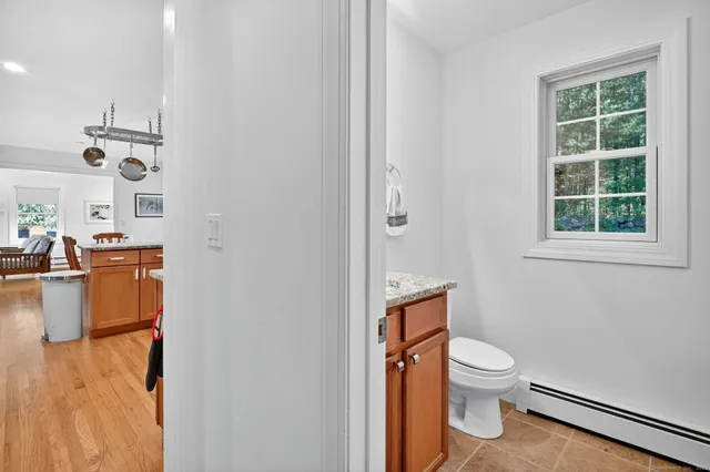 a white toilet sitting next to a bathroom sink