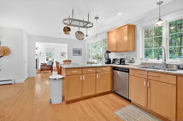 a very nice looking kitchen with a large window