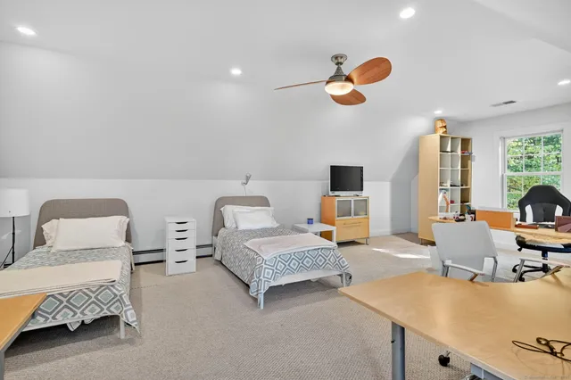 a bedroom with bed and window