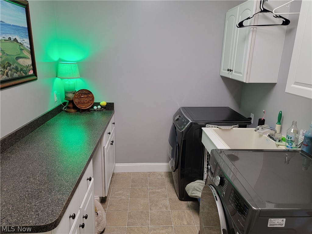 32685 Bagley Road North Ridgeville, OH 44039 - Photo 11 of 34 Firs floor laundry with a ton of storage and space