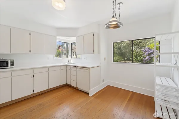a kitchen with a cabinets and window