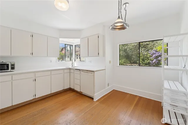 a kitchen with a cabinets and window