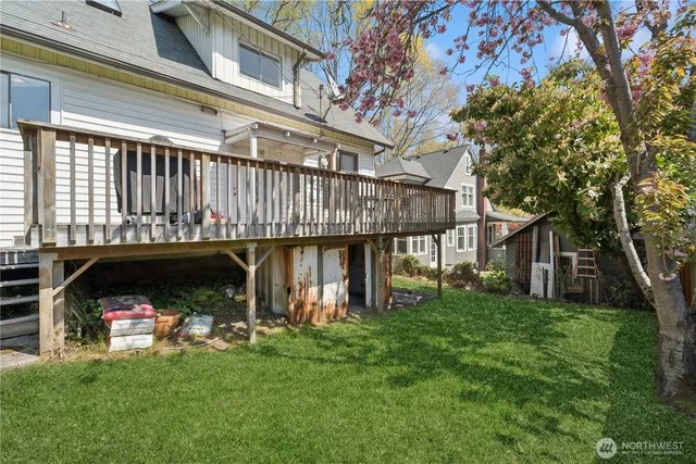 a view of a house with a yard balcony and sitting area