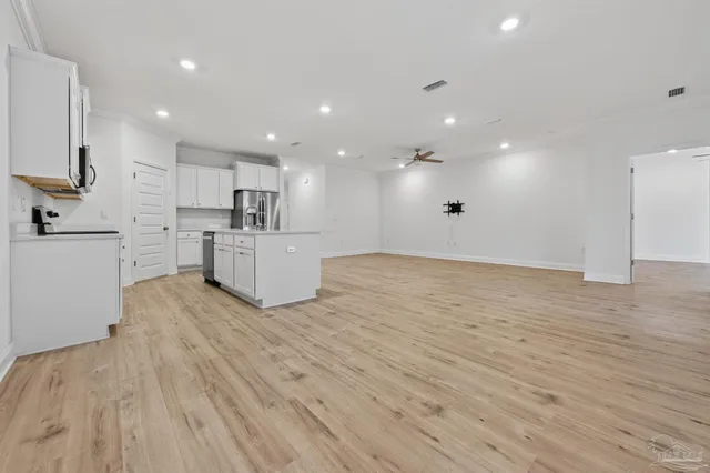 a view of kitchen with wooden floor