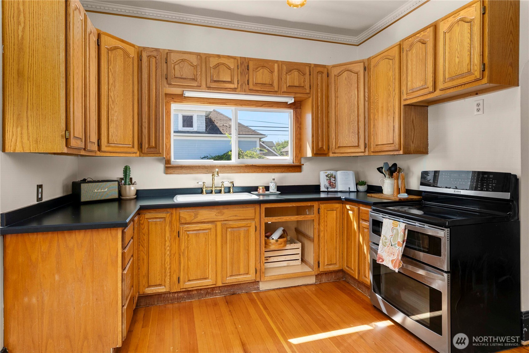 703 E Street Centralia, WA 98531 - Photo 13 of 37 a kitchen with stainless steel appliances granite countertop a stove a sink and a microwave