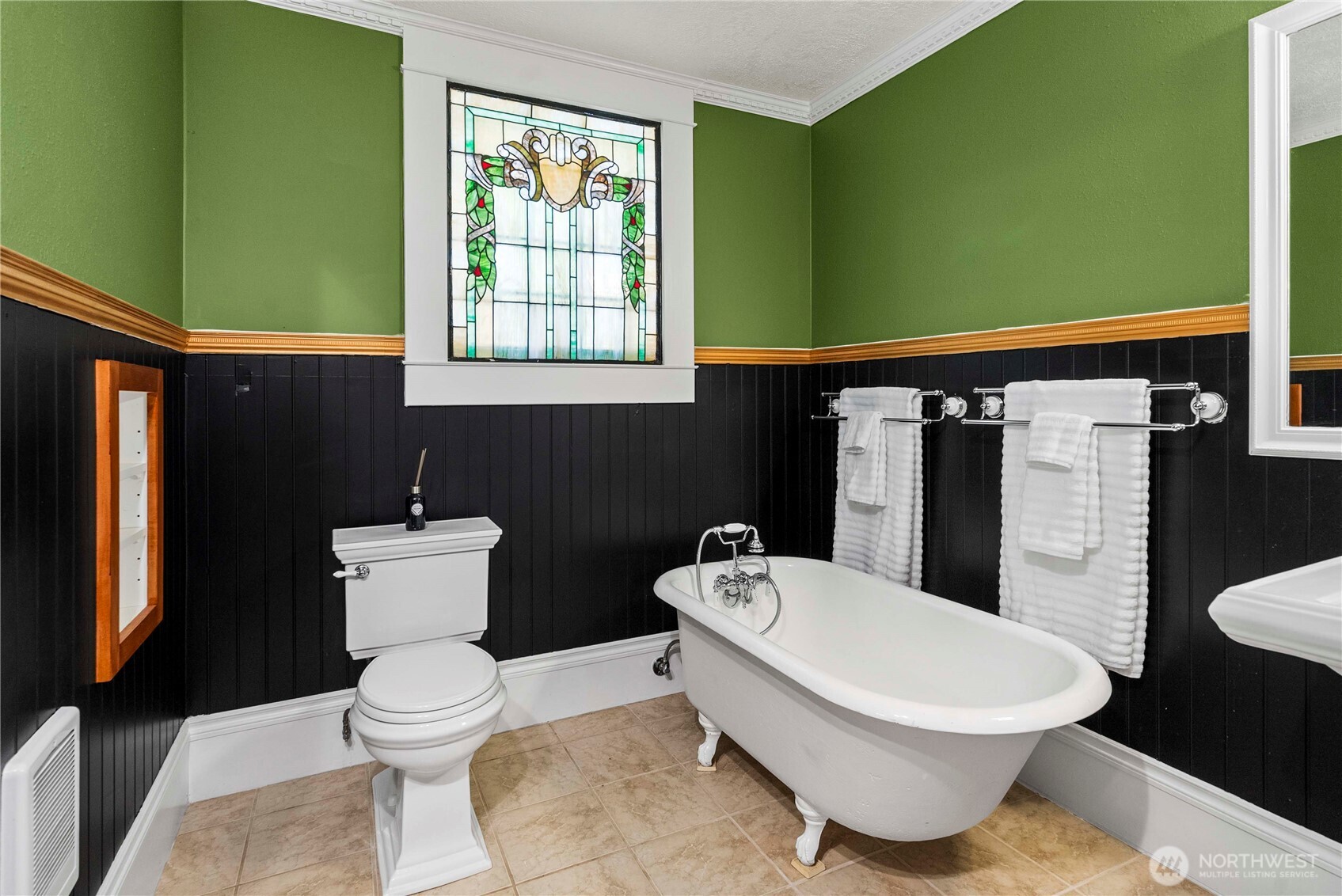 703 E Street Centralia, WA 98531 - Photo 16 of 37 a white toilet sitting next to a bathroom sink