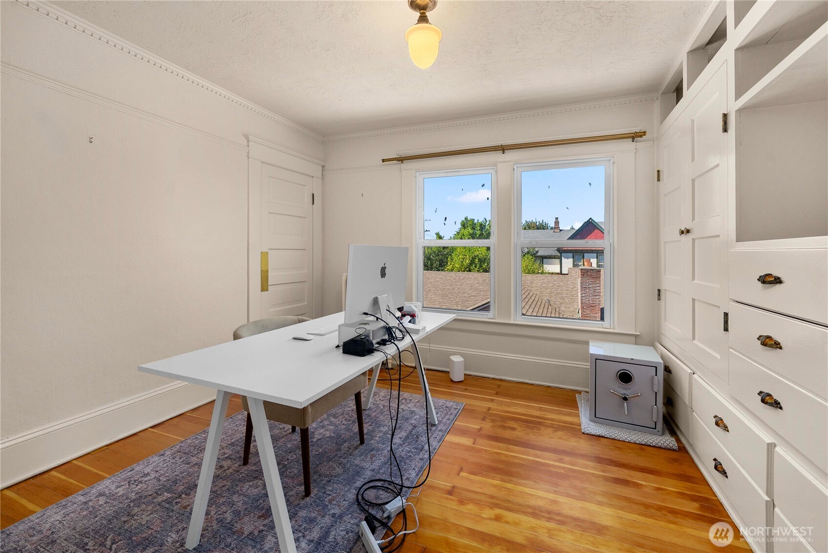 703 E Street Centralia, WA 98531 - Photo 22 of 37 a living room with furniture and a wooden floor