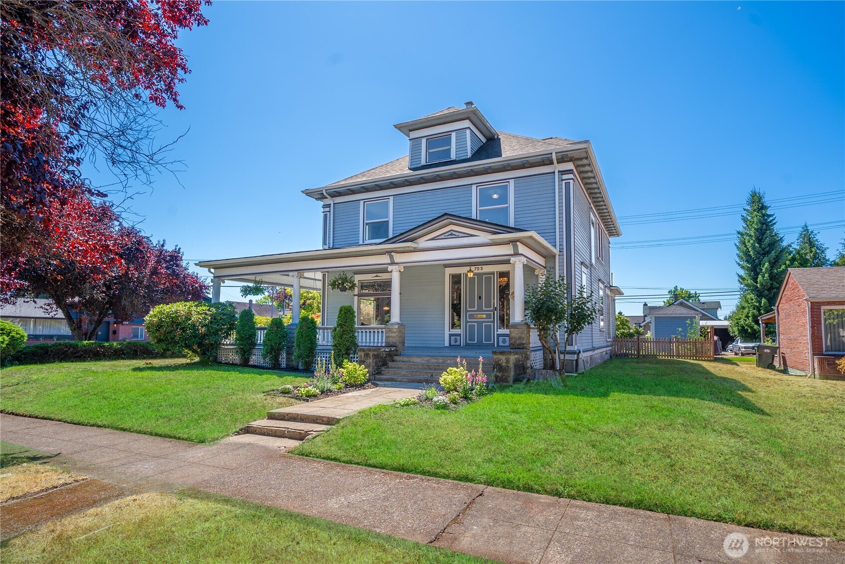 703 E Street Centralia, WA 98531 - Photo 35 of 37 a front view of a house with a yard table and chairs