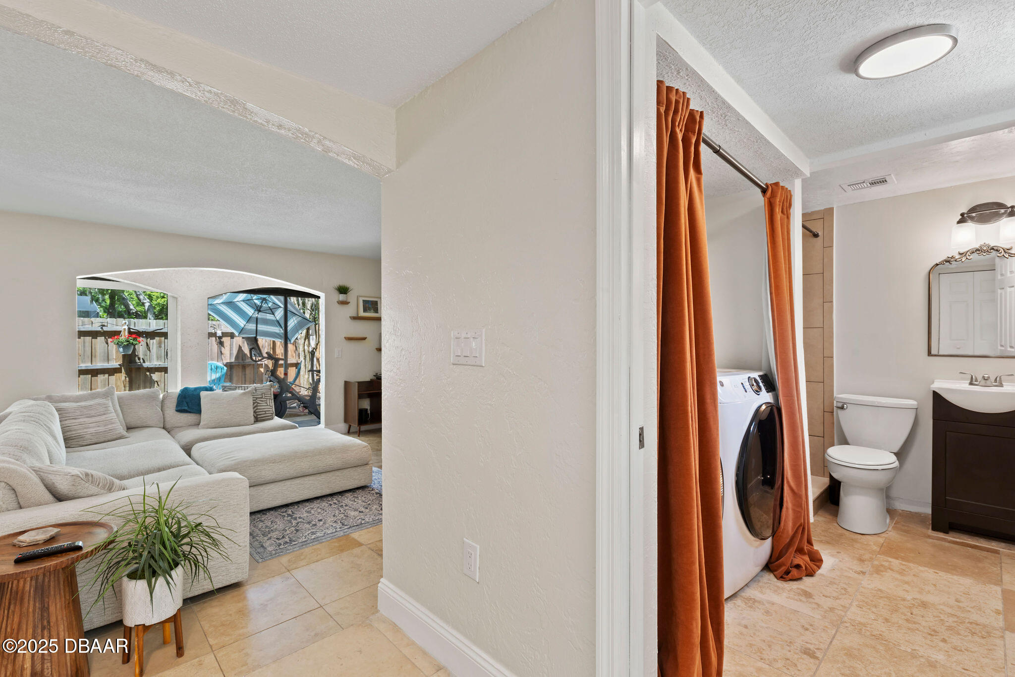 208 Pine Cone Trail Ormond Beach, FL 32174 - Photo 11 of 45 a living room with furniture and a gate