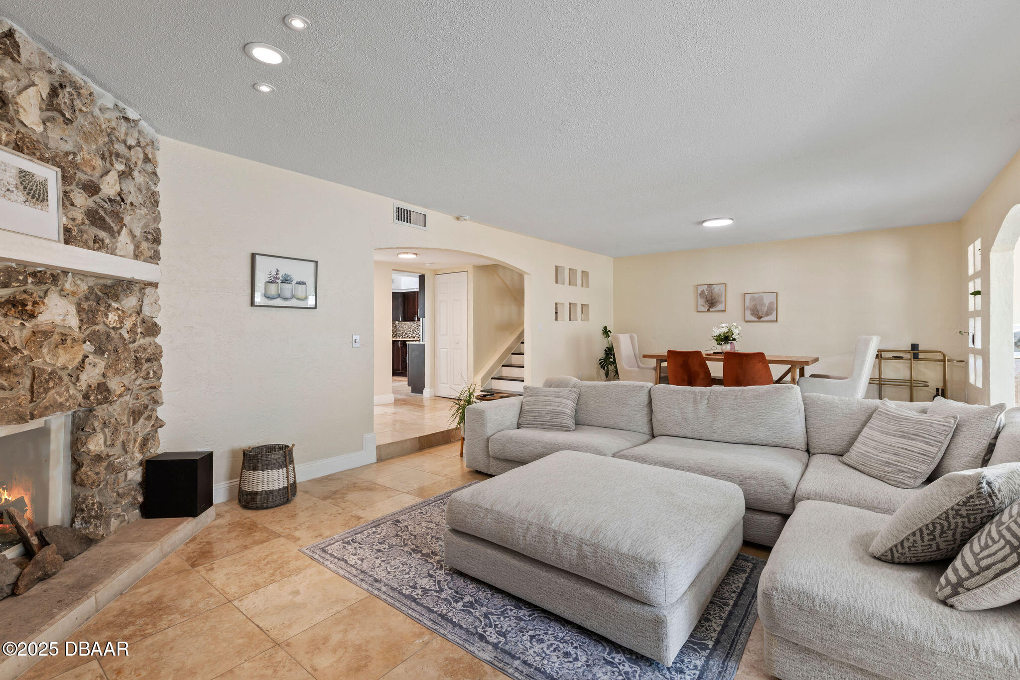 208 Pine Cone Trail Ormond Beach, FL 32174 - Photo 19 of 45 a living room with furniture and a fireplace
