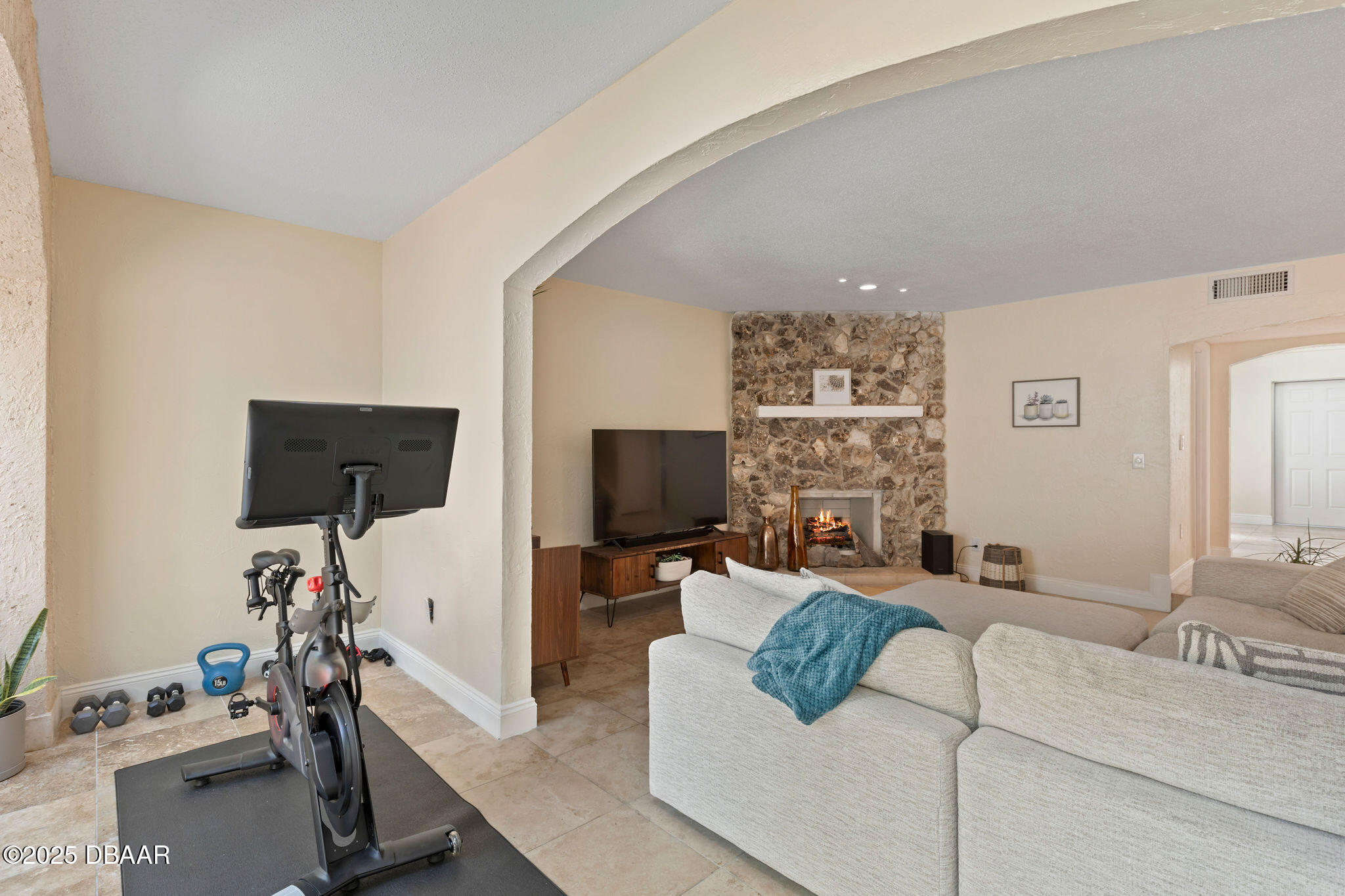 208 Pine Cone Trail Ormond Beach, FL 32174 - Photo 22 of 45 a living room with furniture a flat screen tv and a window