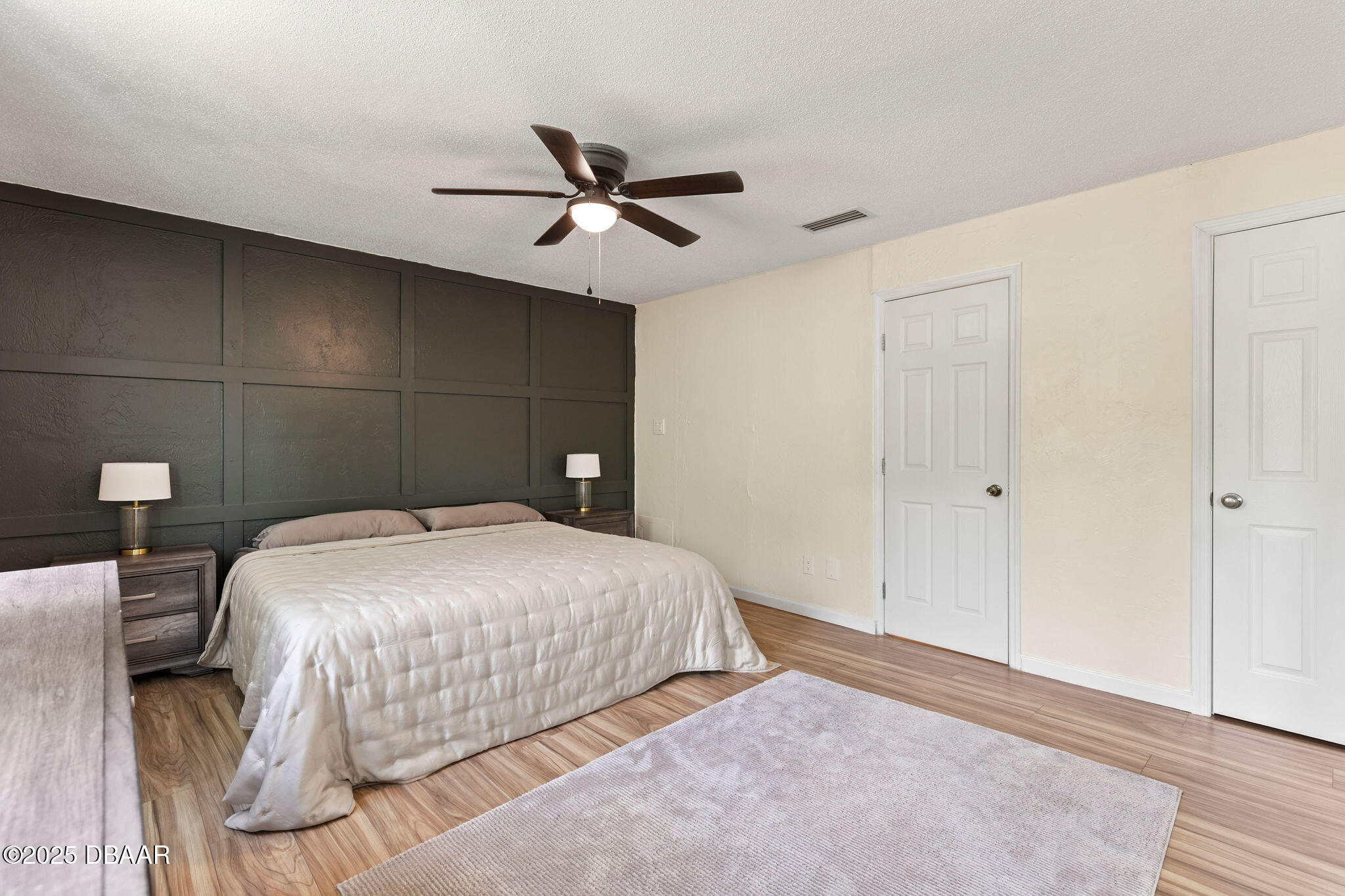 208 Pine Cone Trail Ormond Beach, FL 32174 - Photo 30 of 45 a bedroom with a bed and a ceiling fan