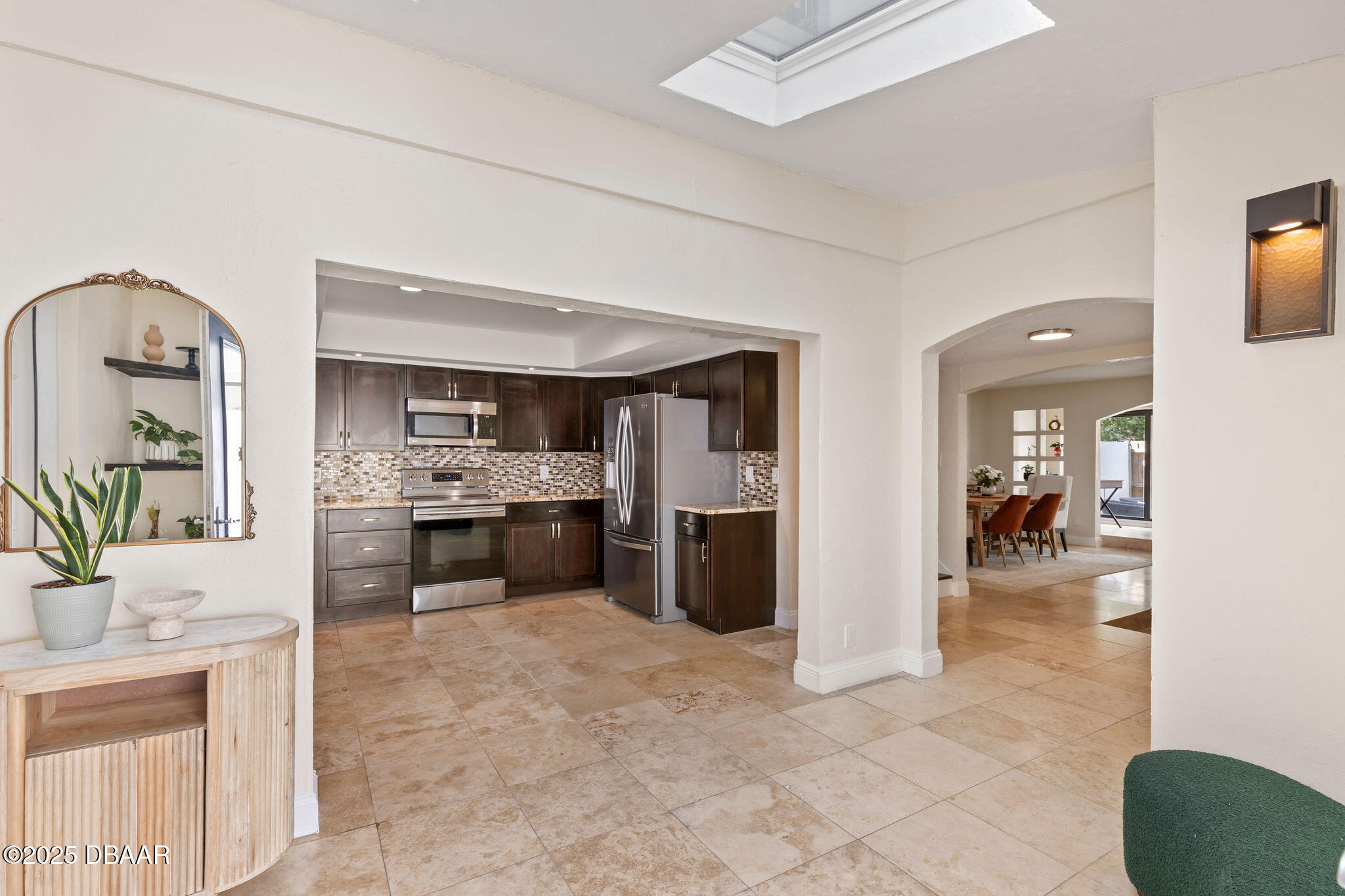 208 Pine Cone Trail Ormond Beach, FL 32174 - Photo 3 of 45 a kitchen with a refrigerator and a sink