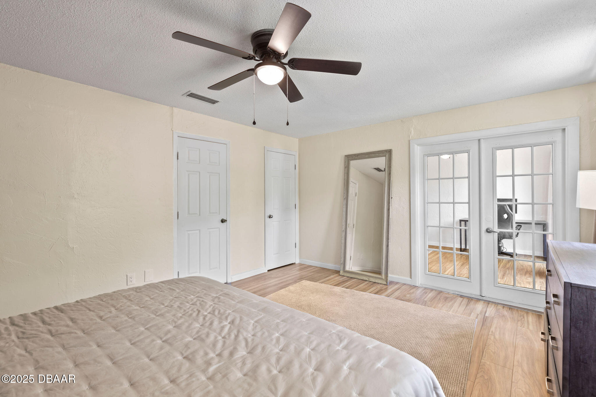 208 Pine Cone Trail Ormond Beach, FL 32174 - Photo 31 of 45 a bedroom with a large bed and a large window
