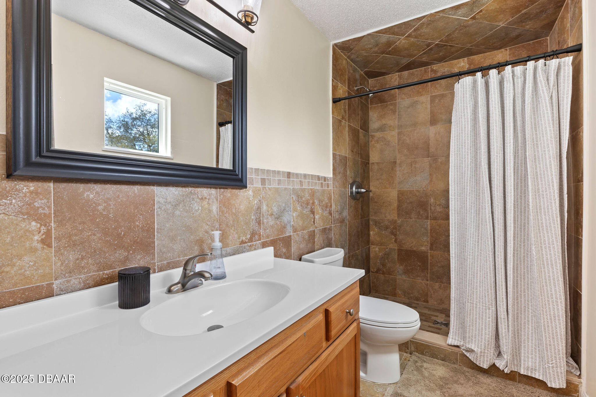 208 Pine Cone Trail Ormond Beach, FL 32174 - Photo 32 of 45 a bathroom with a sink toilet and shower