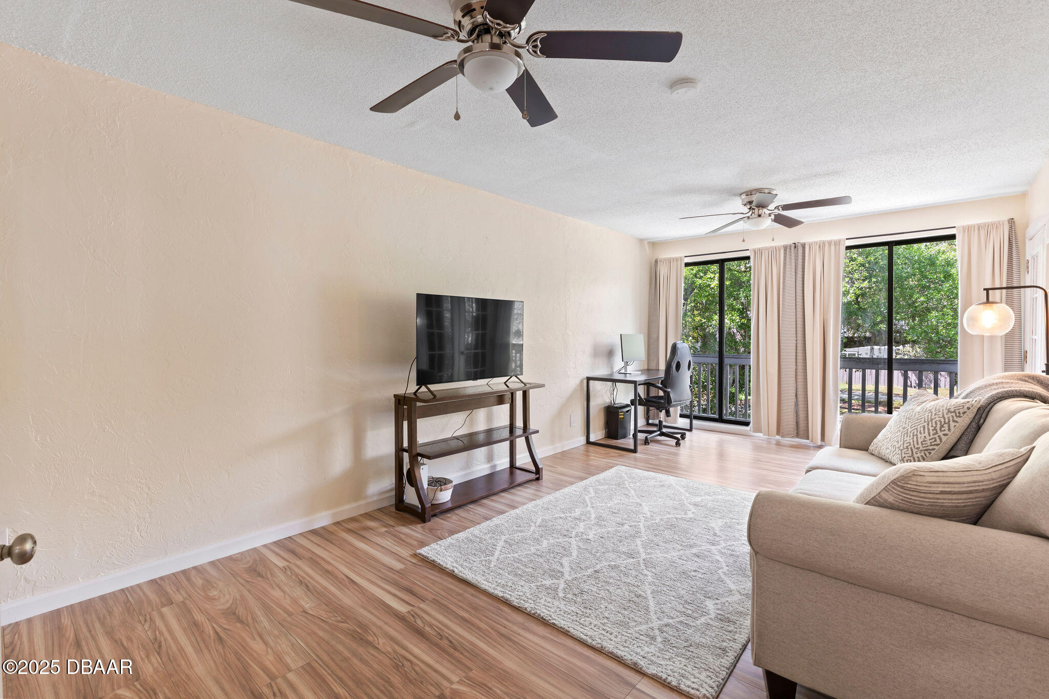 208 Pine Cone Trail Ormond Beach, FL 32174 - Photo 34 of 45 a living room with furniture and a flat screen tv