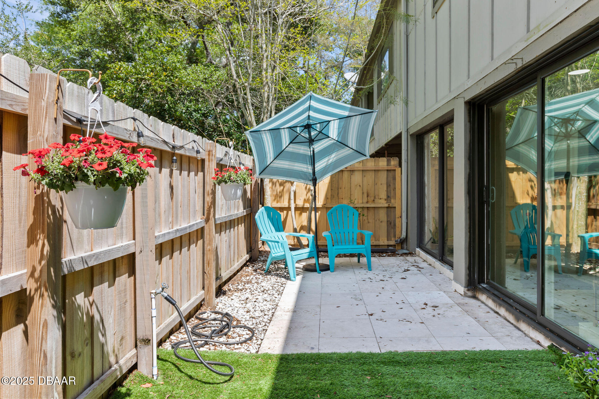 208 Pine Cone Trail Ormond Beach, FL 32174 - Photo 40 of 45 a backyard of a house with table and chairs