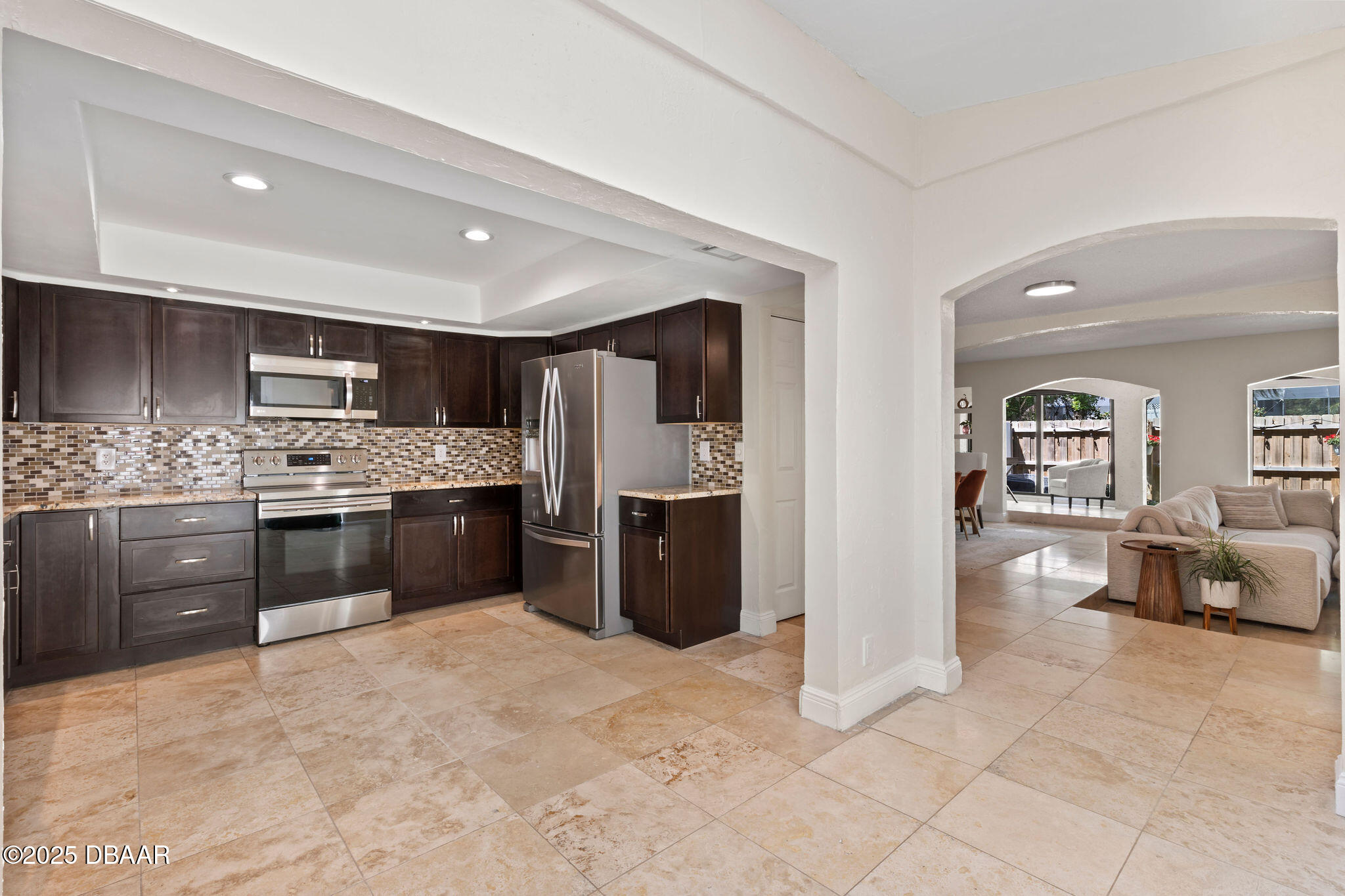 208 Pine Cone Trail Ormond Beach, FL 32174 - Photo 4 of 45 a kitchen with stainless steel appliances a refrigerator sink and cabinets