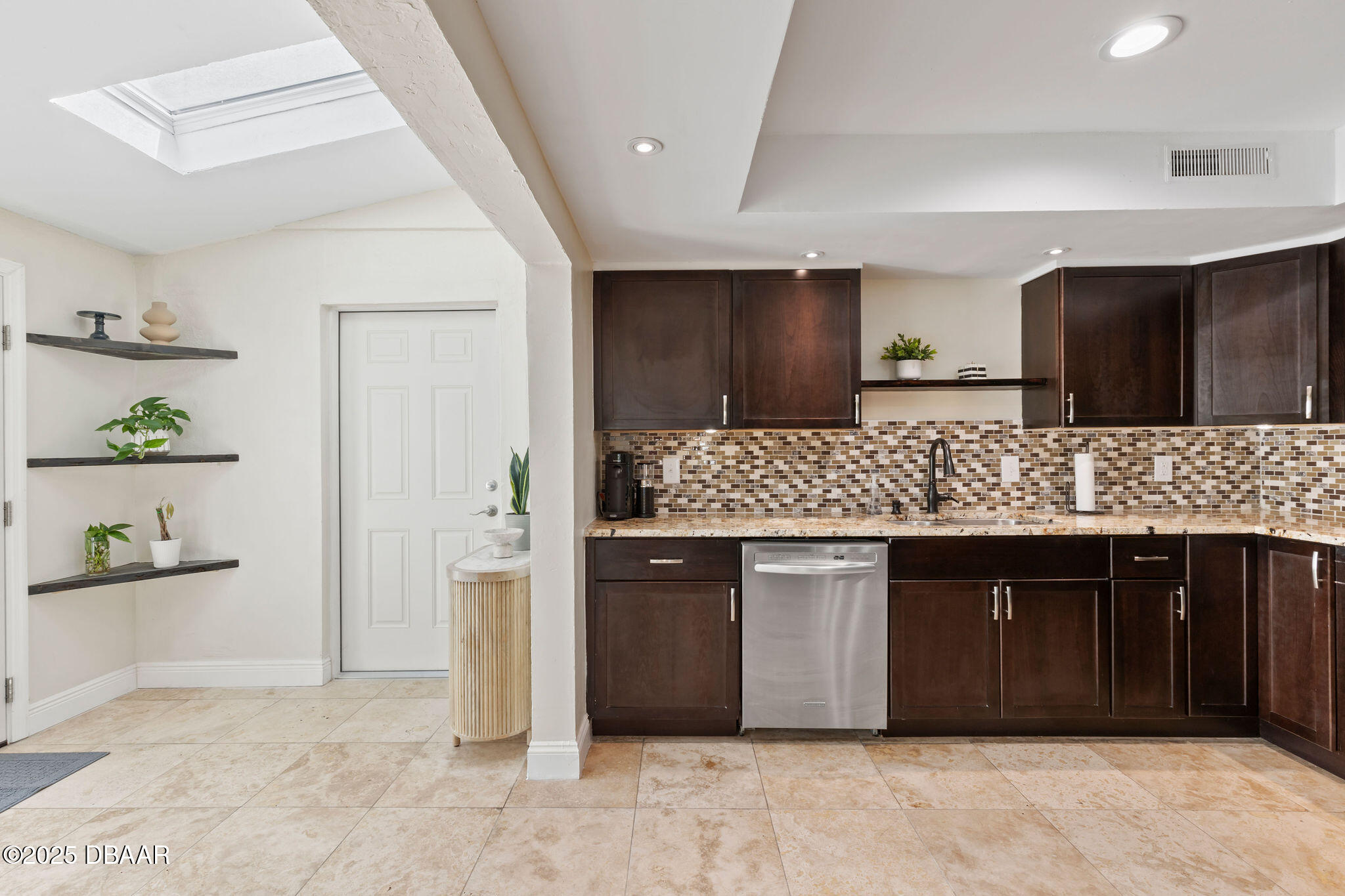 208 Pine Cone Trail Ormond Beach, FL 32174 - Photo 8 of 45 a kitchen with a sink refrigerator and microwave
