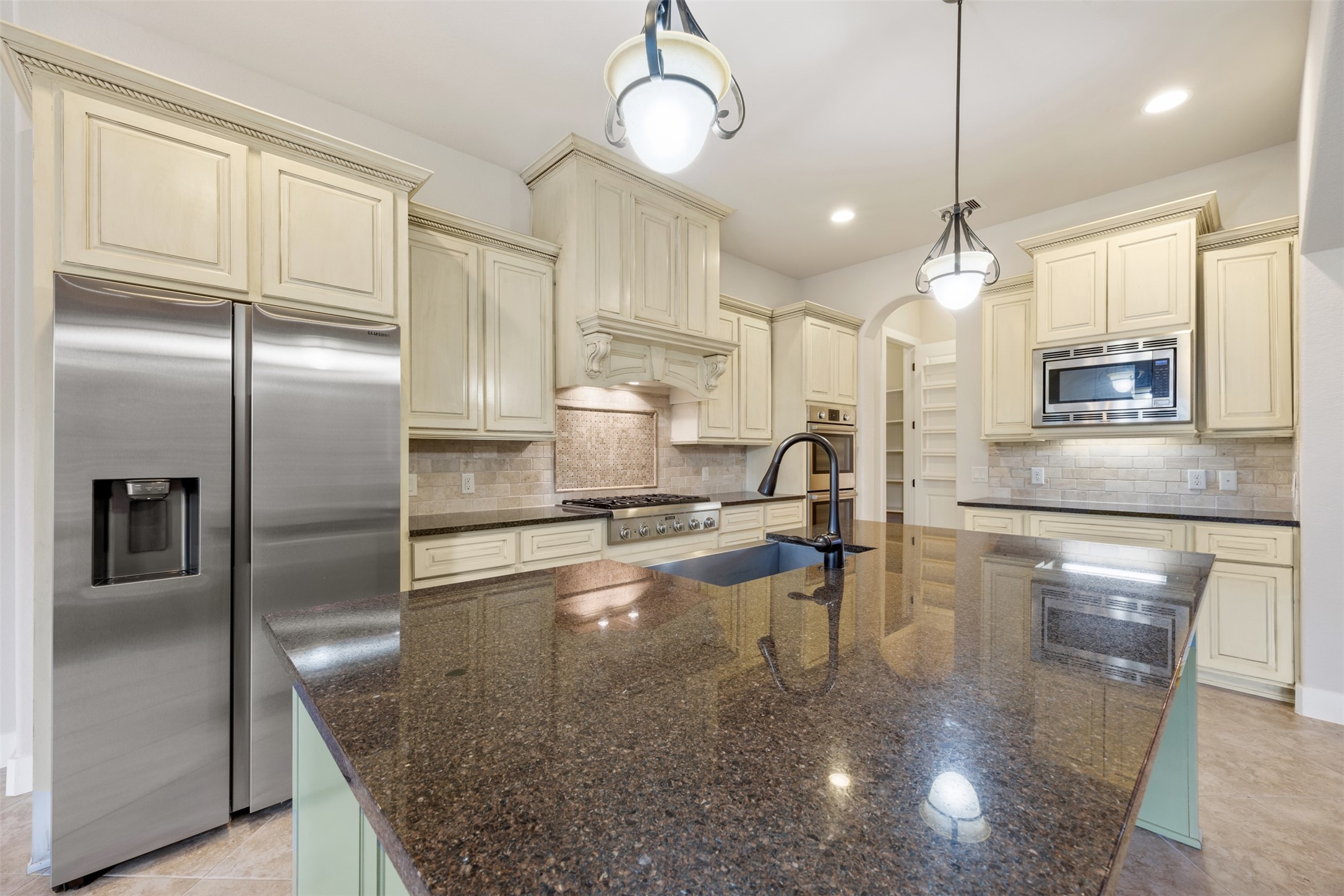 6515 Fraser Point Spring, TX 77379 - Photo 6 of 39 a kitchen with stainless steel appliances granite countertop a refrigerator a oven and a sink