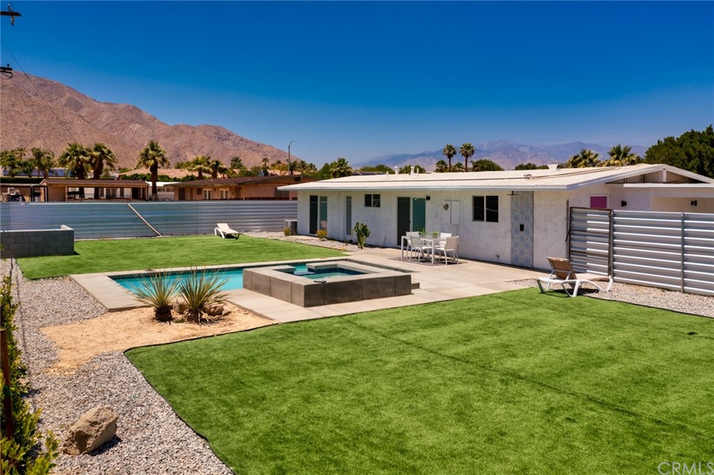 835 Rosa Parks Road Palm Springs, CA 92262 - Photo 1 of 1 a view of a patio with a table and chairs