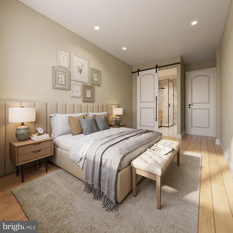 a spacious bedroom with a bed and a couch