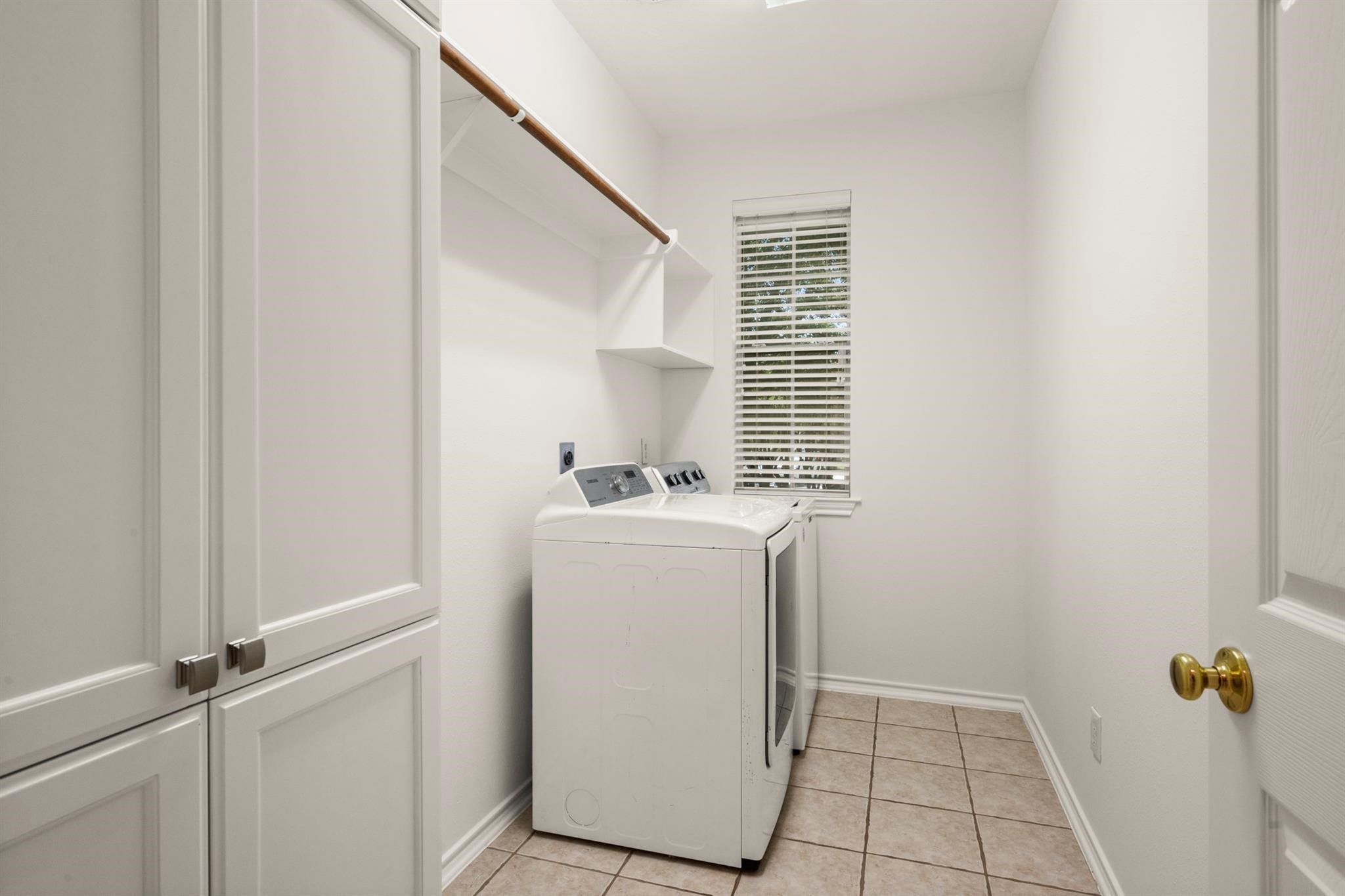 21014 Jessica Rose Lane Spring, TX 77379 - Photo 26 of 30 a utility room with a window dryer and washer