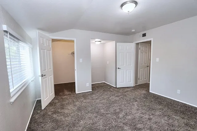 a front view of house with yard and outdoor seating