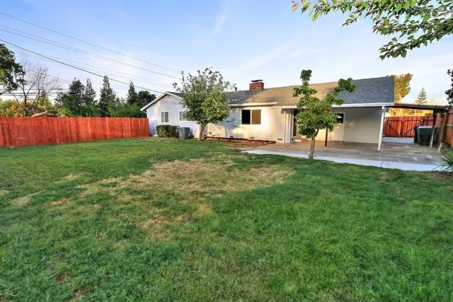 a view of a backyard with garden