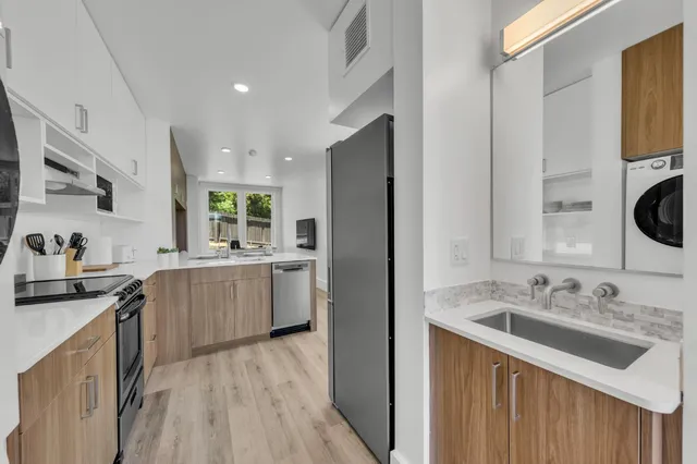 a view of a hallway view with wooden floor and staircase