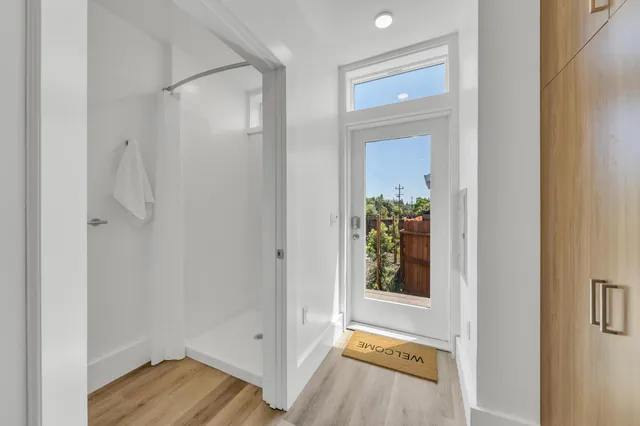 a kitchen with a stove and white cabinets