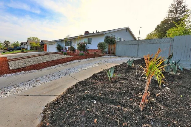 a view of a backyard with sitting area