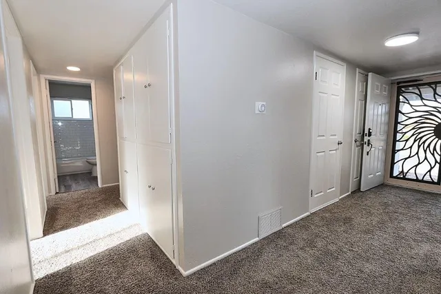 a kitchen with a sink a stove and cabinets