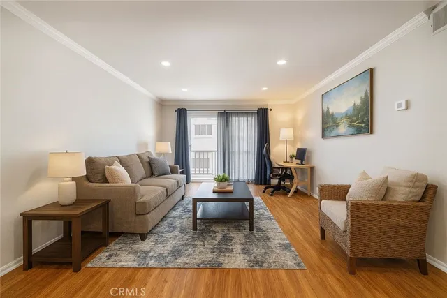 a kitchen with stainless steel appliances granite countertop a stove microwave and refrigerator