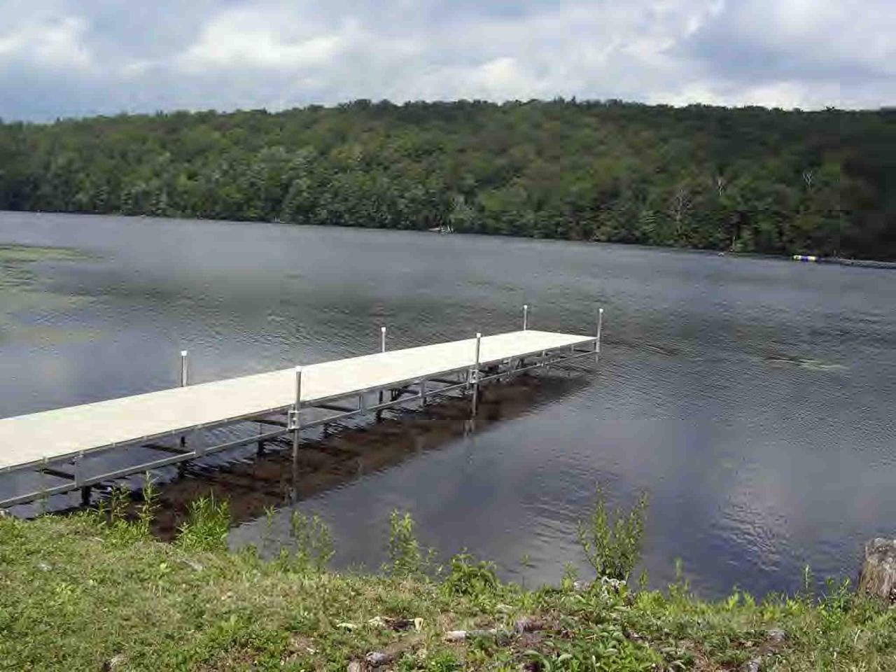 2304 North Main Road Otis, MA 01253 - Photo 2 of 8 a view of a lake in middle of forest