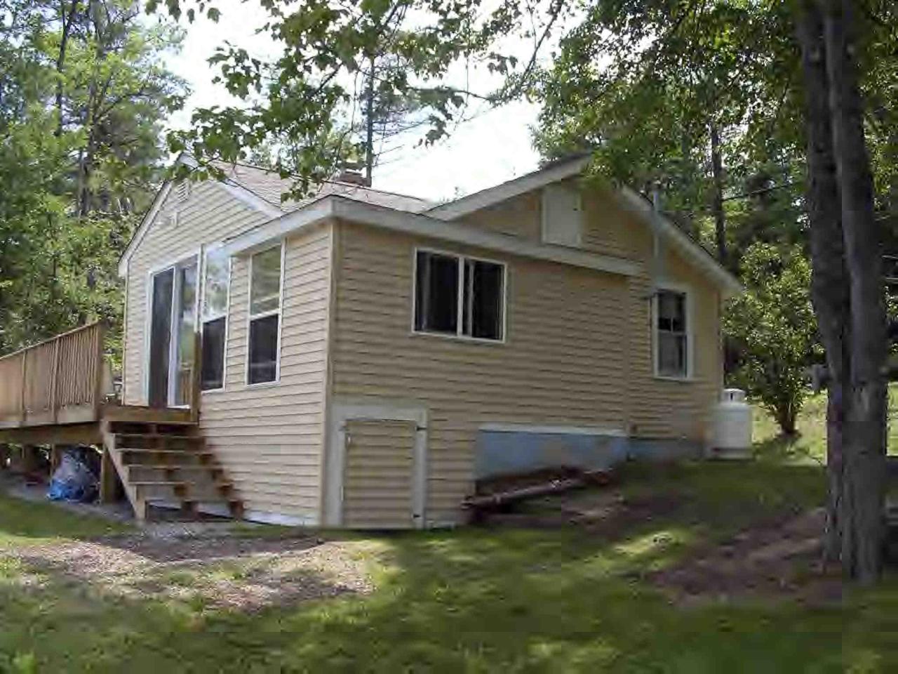 2304 North Main Road Otis, MA 01253 - Photo 5 of 8 a view of a house with a yard