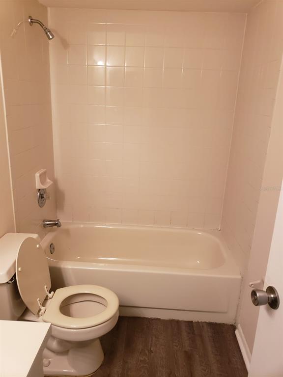 2979 Day Road, Unit C Deltona, FL 32738 - Photo 12 of 17 a bathroom with a toilet and a shower