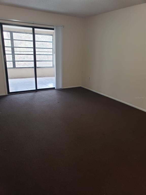 2979 Day Road, Unit C Deltona, FL 32738 - Photo 4 of 17 a view of empty room with window