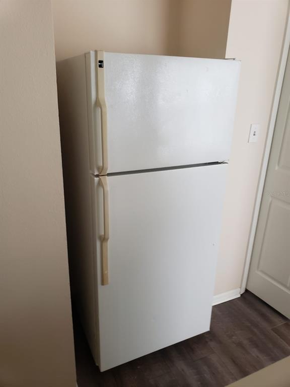2979 Day Road, Unit C Deltona, FL 32738 - Photo 10 of 17 a white refrigerator freezer and a wooden floor