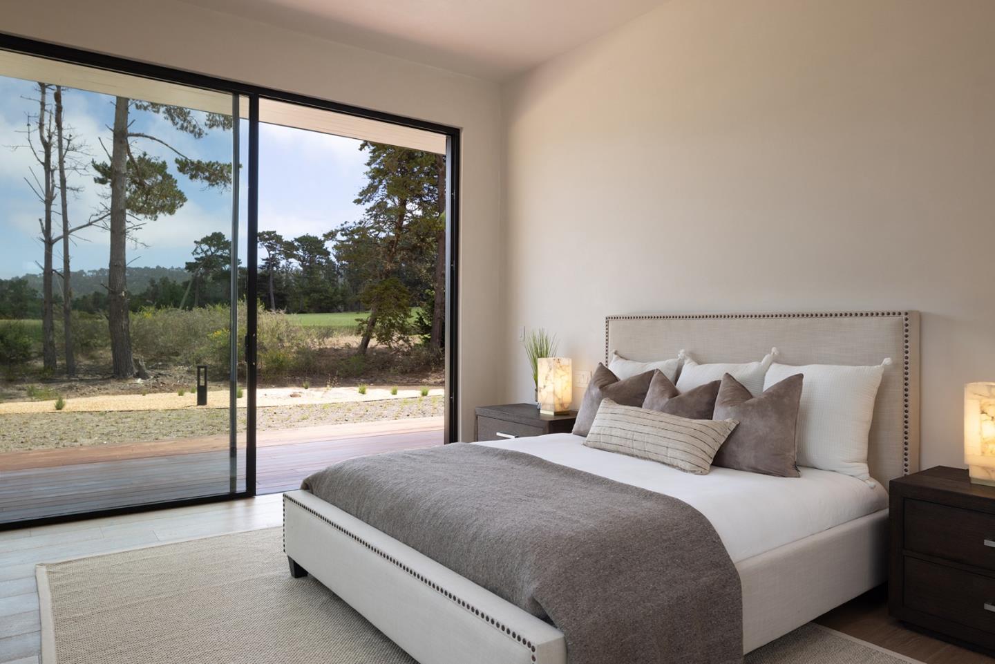 31 Poppy Lane Pebble Beach, CA 93953 - Photo 23 of 45 a bedroom with a large bed and a large window