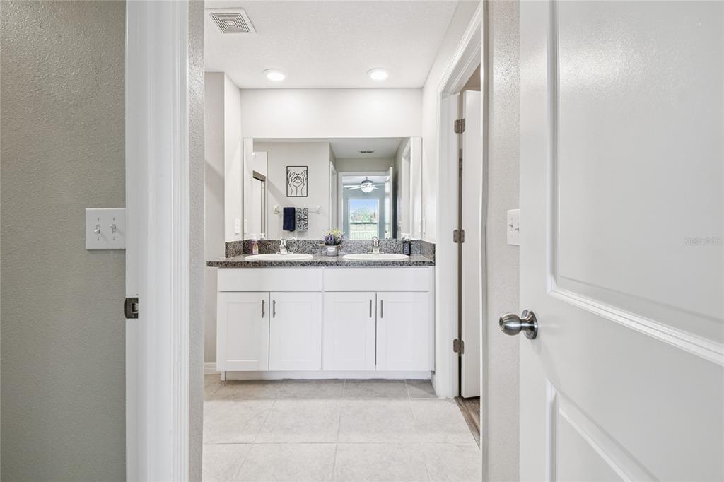 1735 Ripple Jade Place Ruskin, FL 33570 - Photo 21 of 68 a bathroom with a sink and a mirror