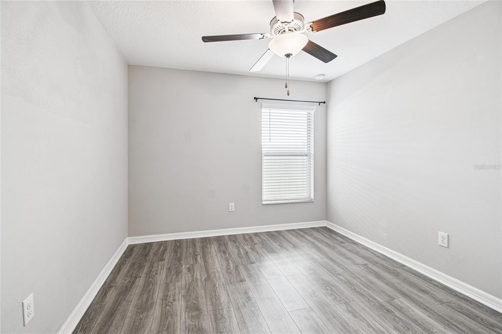 1735 Ripple Jade Place Ruskin, FL 33570 - Photo 33 of 68 an empty room with a window and a fan