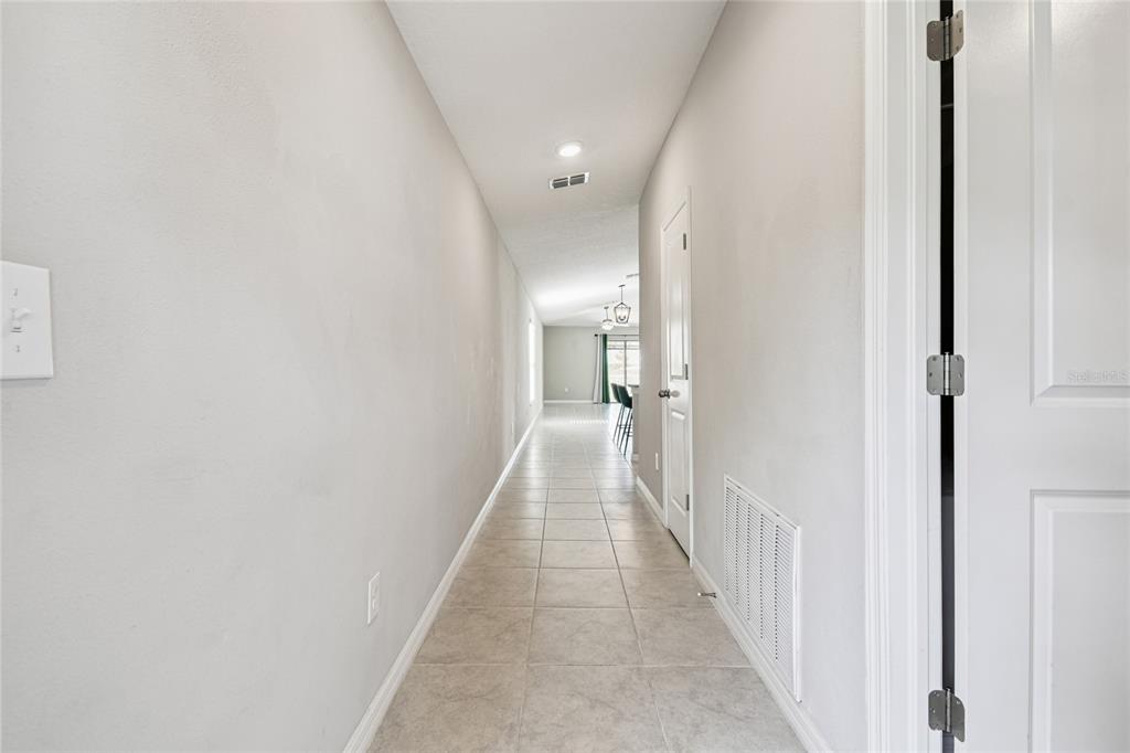 1735 Ripple Jade Place Ruskin, FL 33570 - Photo 4 of 68 a view of a hallway with a white walls