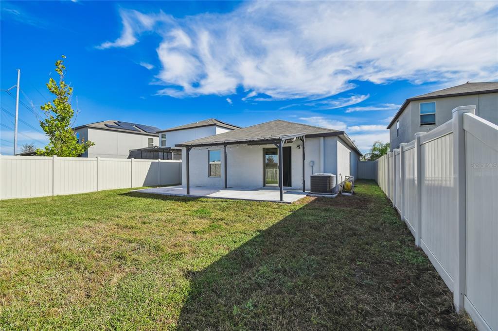 1735 Ripple Jade Place Ruskin, FL 33570 - Photo 41 of 68 a view of a house with backyard and garden