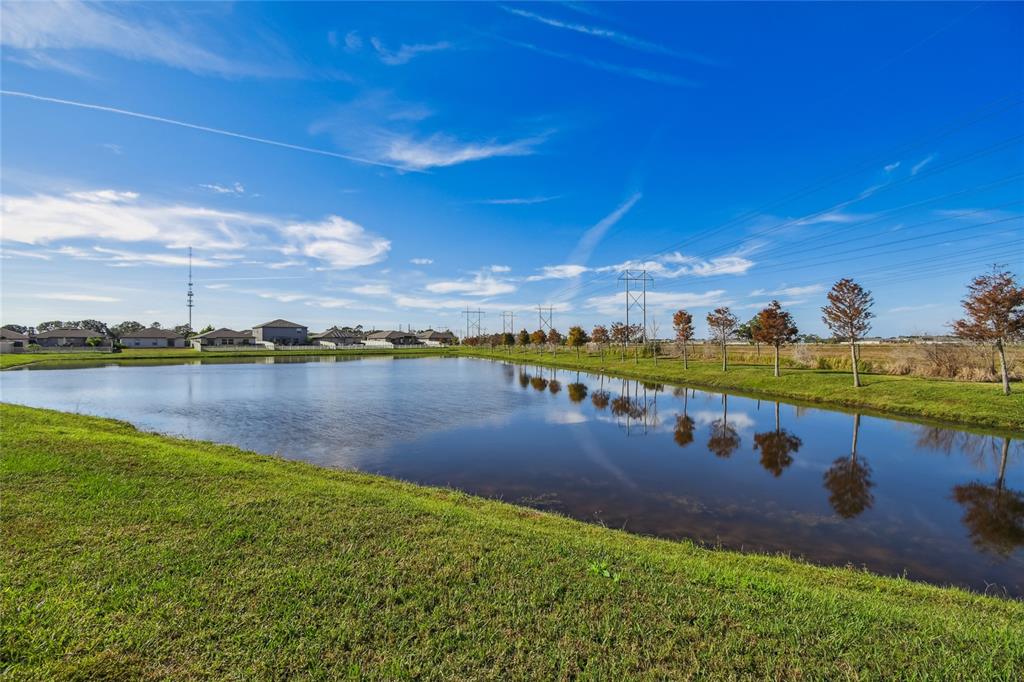 1735 Ripple Jade Place Ruskin, FL 33570 - Photo 46 of 68 a view of a lake with houses in the back