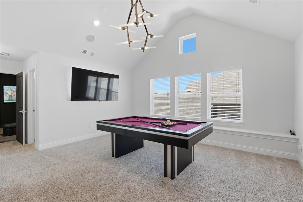 7548 Ridge Lane Grand Prairie, TX 75054 - Photo 23 of 35 Playroom featuring billiards, light colored carpet, and a high ceiling